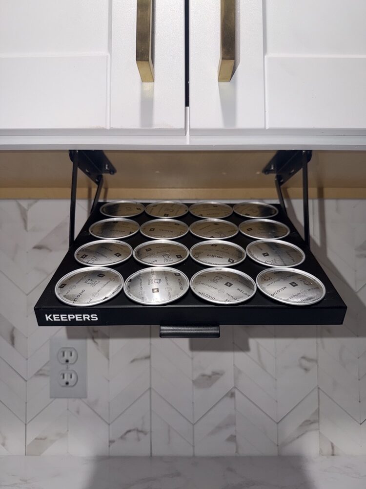 The black Coffee Keeper tray holding 16 Nespresso Vertuo pods