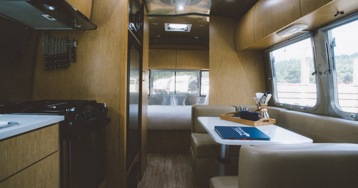 Camper kitchen and dining area inside a motor home for full-time RV living